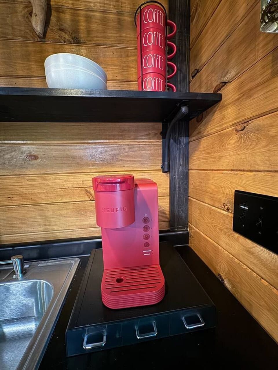 Keurig coffee maker with starter K-cups provided.