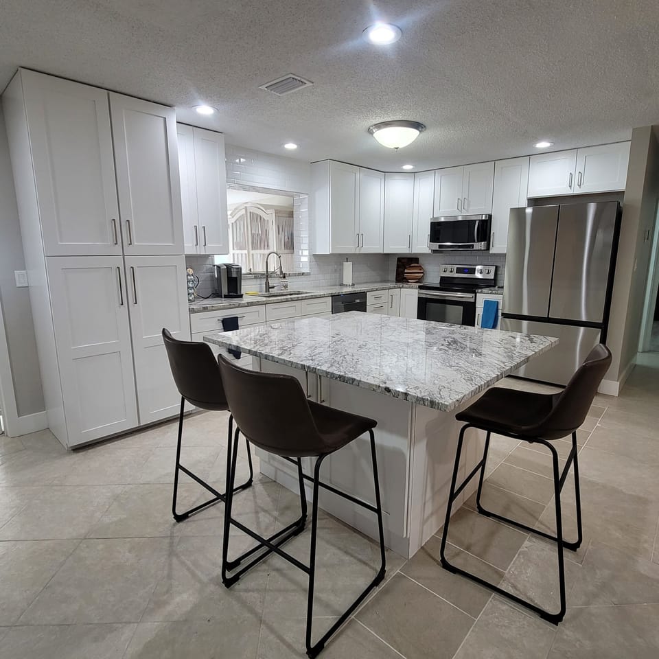 Kitchen has normal and oversized pots and pans for large meals. 