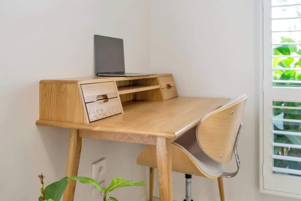 The living area offers a workspace to set up your laptop and work remotely.