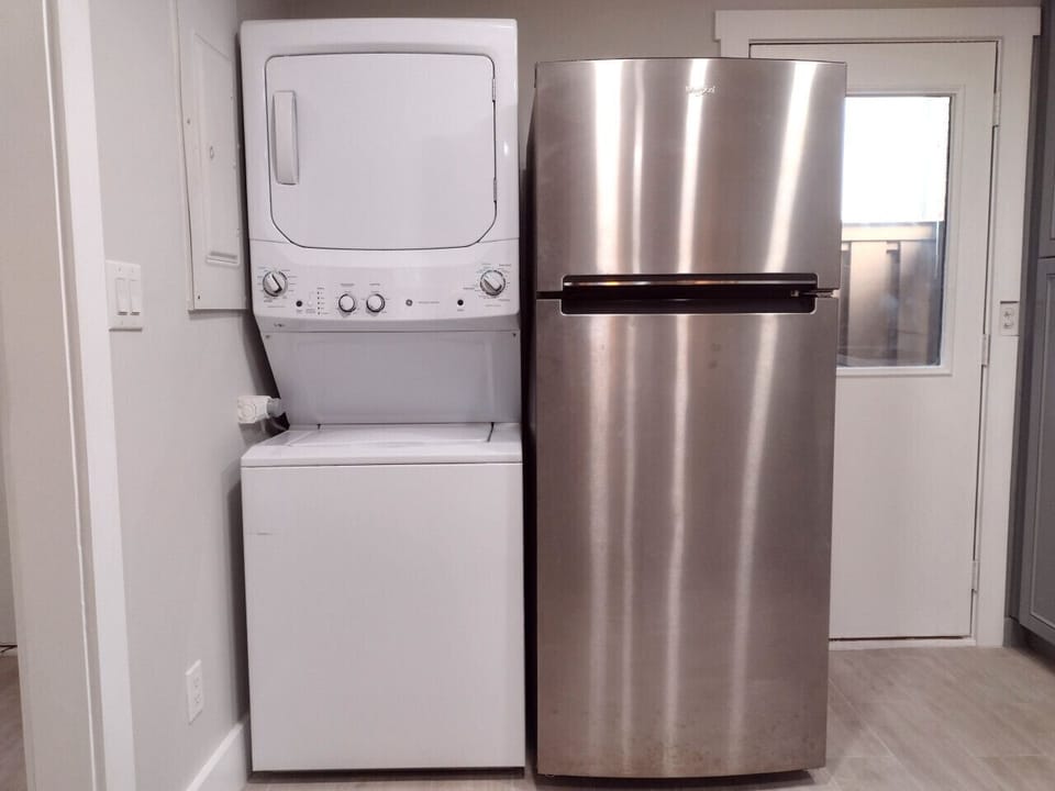 Clean, modern washer, dryer, and refrigerator