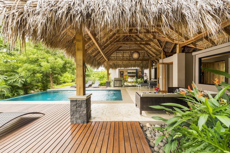 Shaded palm palapa by the infinity pool
