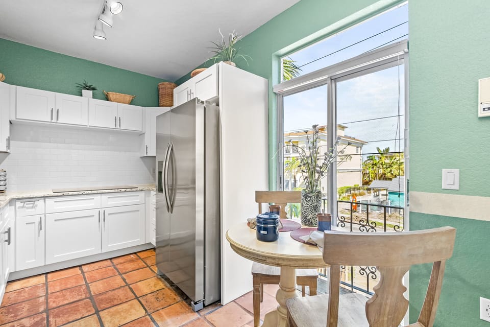 The breakfast nook with a partial view of the kitchen.