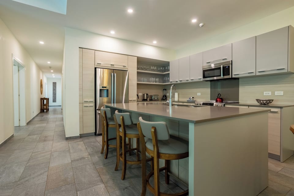 Elegant kitchen island offers both style and practicality, with luxurious finishes.