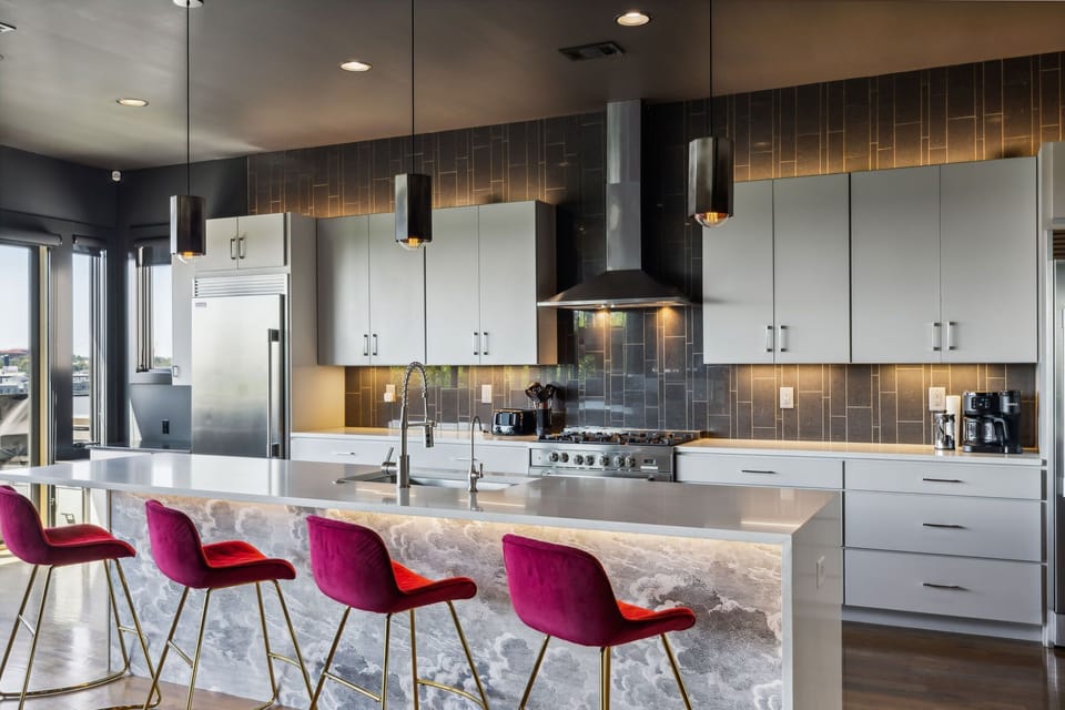 Kitchen 1: Cook with a view! This modern kitchen offers stunning cityscapes while you create sumptuous meals.
