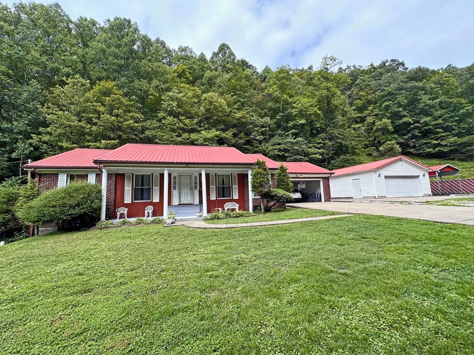 Front w/ driveway garage & carport