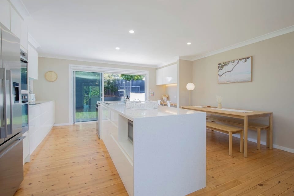 The sleek kitchen comes fully equipped for your holiday catering with modern appliances and cooking utensils.

