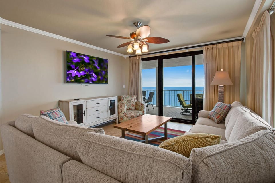 Living room with flat-screen TV and private balcony