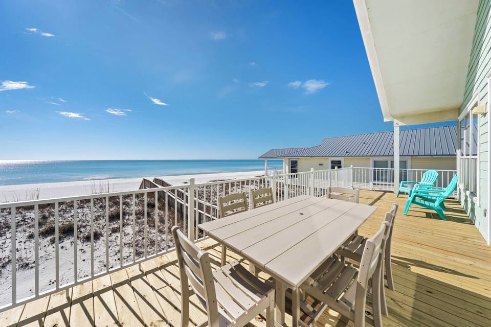 Dine al fresco on the beachfront balcony