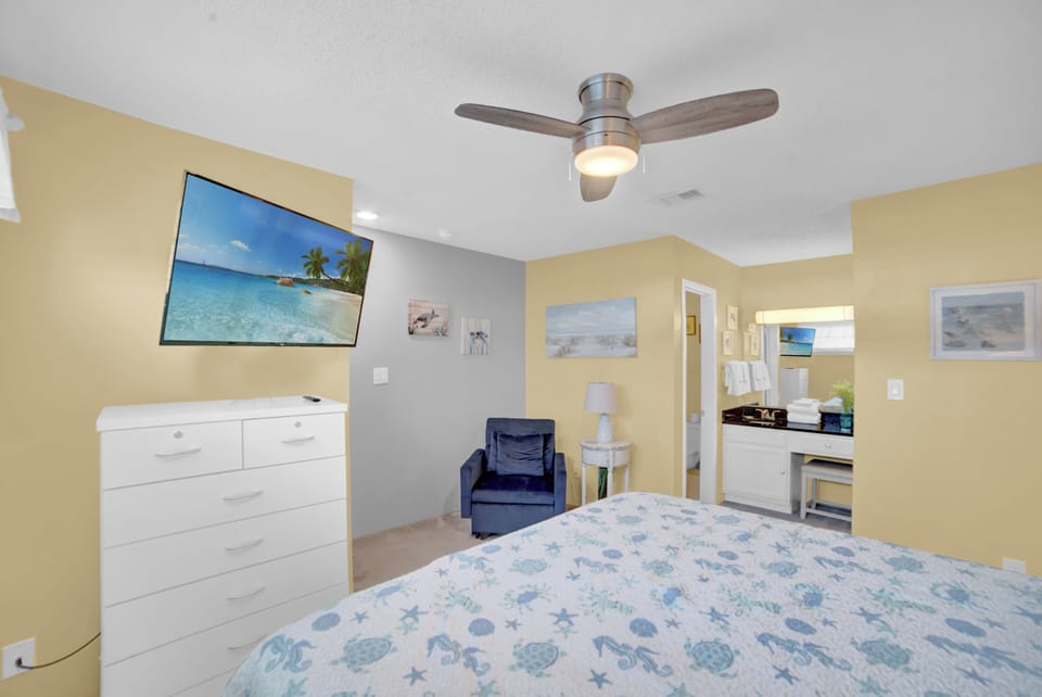 Second floor bedroom with large flat-screen TV