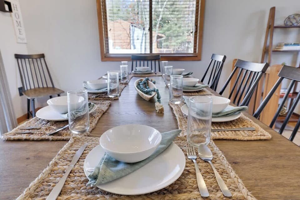 Set for a feast! Everything is ready for a wonderful dining experience—plates, cutlery, and glasses all set!