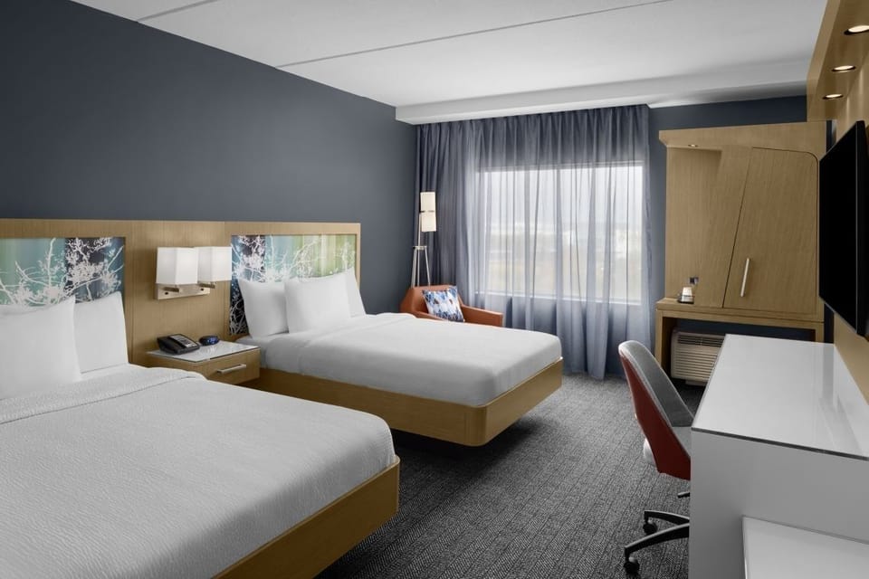 Stretch out on plush beds in a modern, airy retreat.