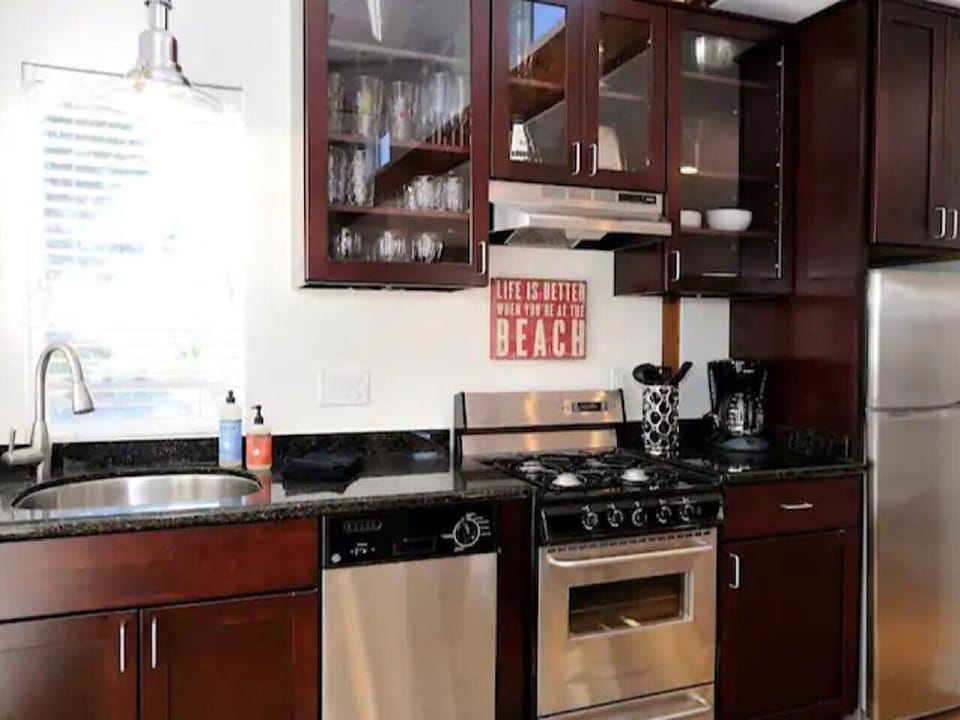 Cook with ease in the well-stocked kitchen, complete with cookware, coffee maker, and all the essentials for dining at home.