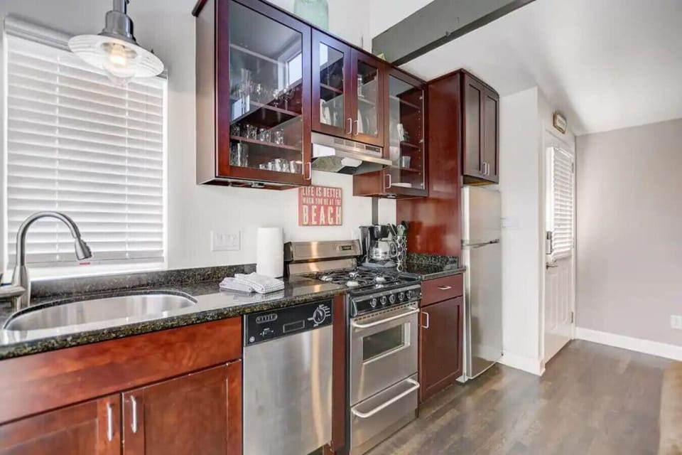 The fully equipped kitchen features modern appliances and everything you need to prepare meals during your coastal getaway.
