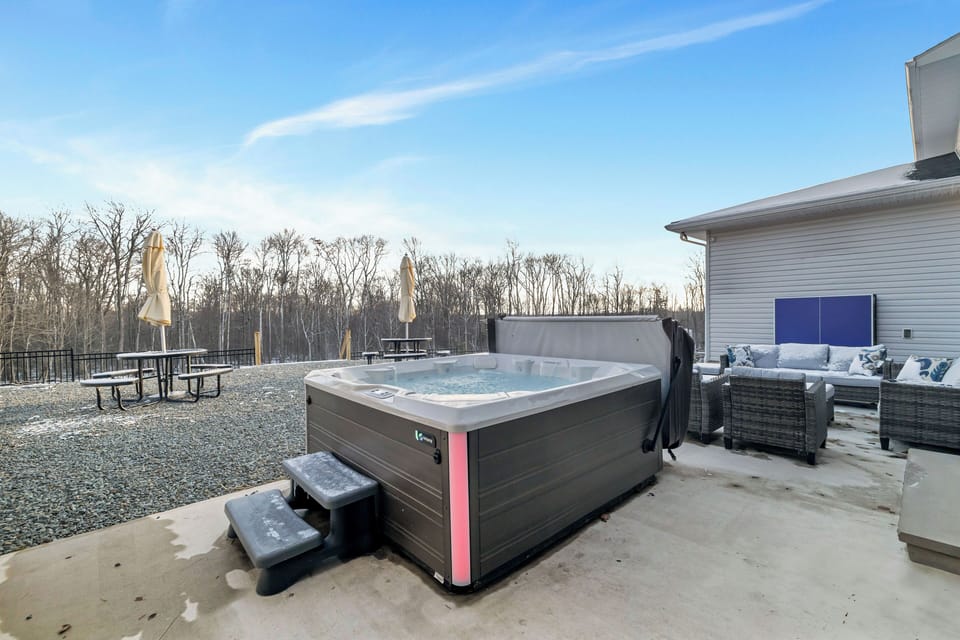 Outdoor hot tub perfect for evening relaxation under the stars.