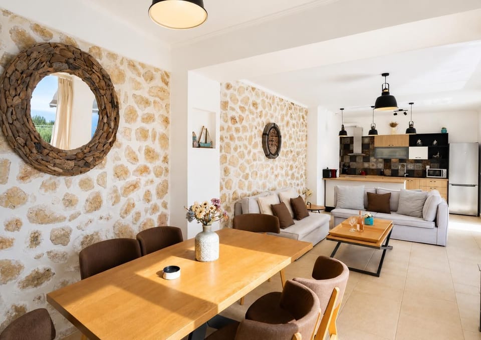 Open-plan living room with sofa, dining area, kitchen, WiFi internet, and satellite TV