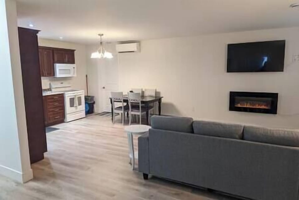 Living area with fireplace & TV
