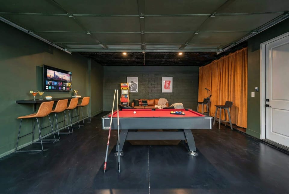 Unwind in style at this chic Nashville vacation home featuring a fabulous game room perfect for friendly competitions! Enjoy leisurely evenings with drinks and laughter at Misfit Homes. Reserve your stay today and embrace the Music City vibe!