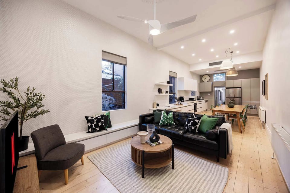 Main living room leading to kitchen and dining area