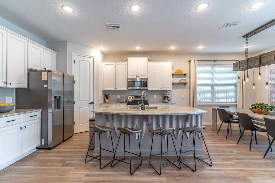Modern Kitchen Features a Full Size Breakfast Bar w/Seating