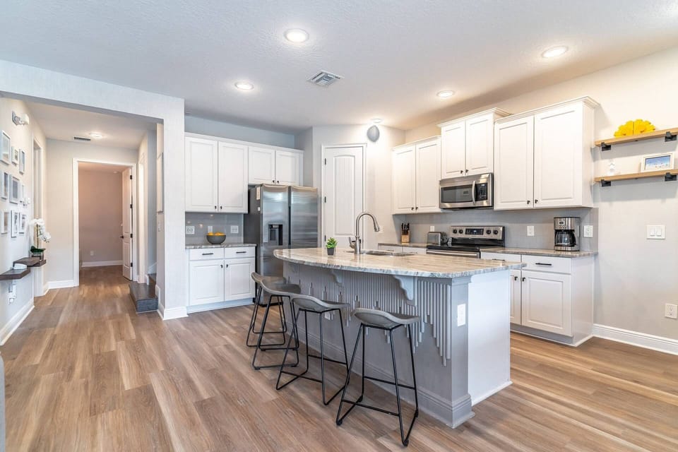 Granite Countertops and Stainless Steel Appliances in this Spacious Kitchen