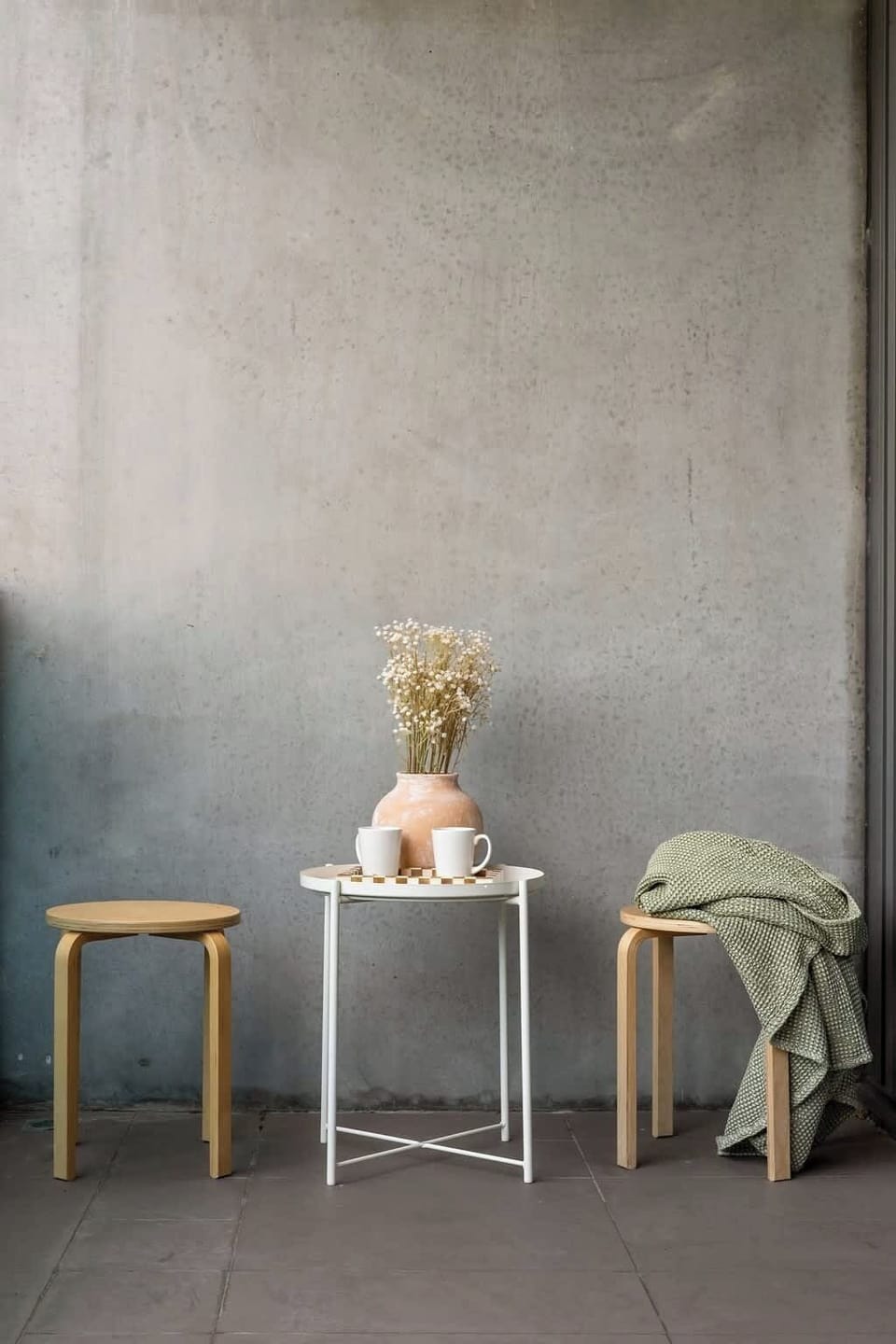 A large balcony. *(Stools and coffee table from living area)