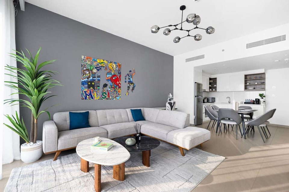 The modern living space with plush seating and vibrant pop art accents