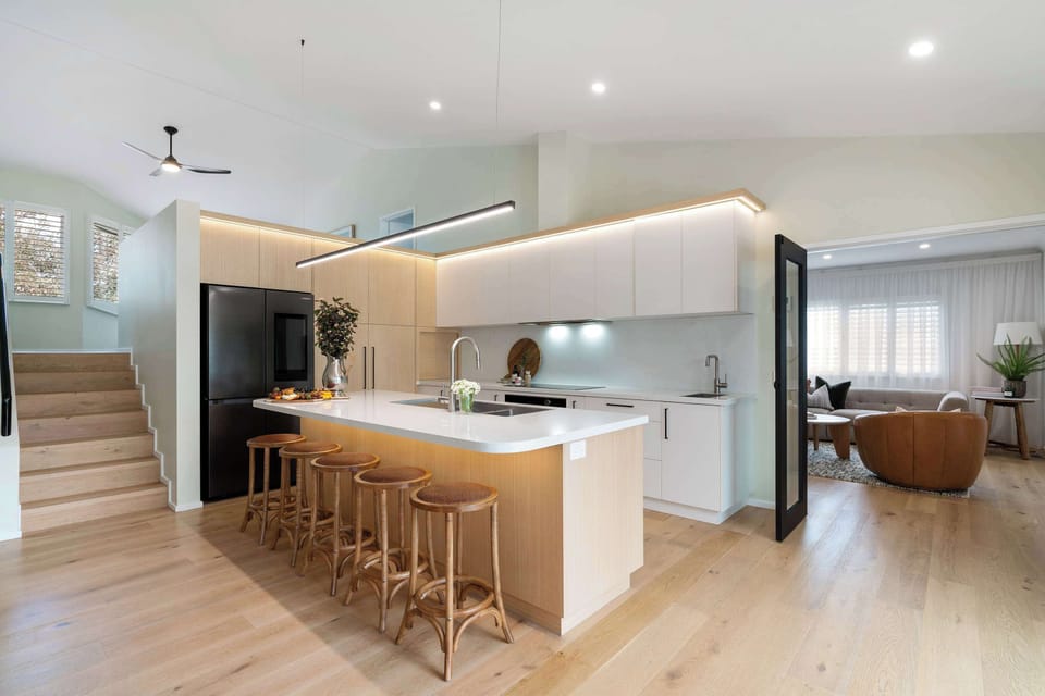The kitchen opens directly into the sitting room, cinema room, dining and outdoor spaces.