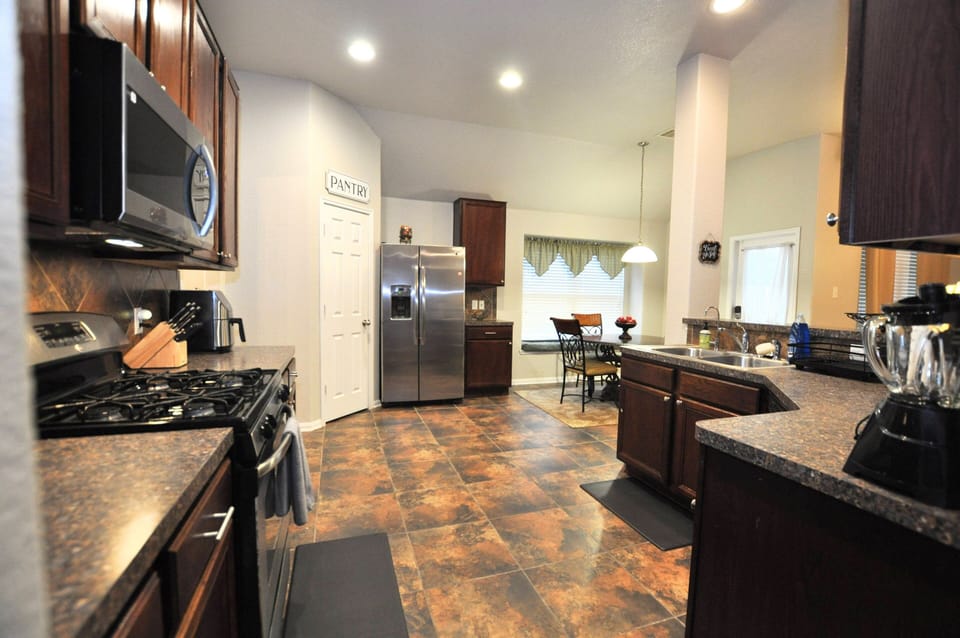 Full kitchen with Dishwasher, gas stove, microwave, Kruiag coffee maker and more