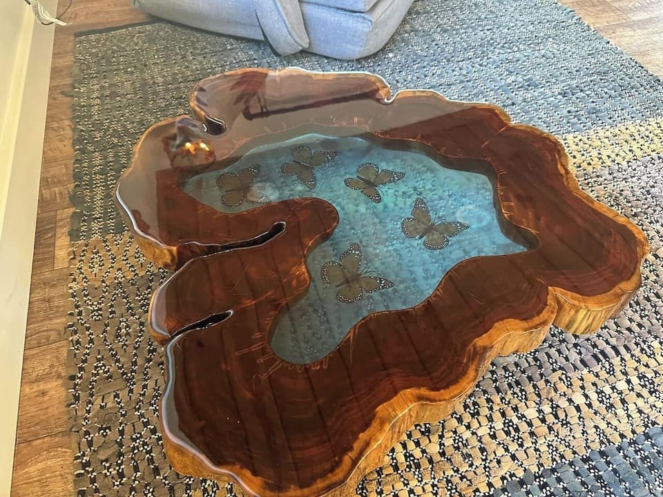 Butterfly Creek Cottage: The butterfly table steals the spotlight—a gorgeous piece that’s equal parts furniture and art, perfect for fluttering conversations or morning coffee.