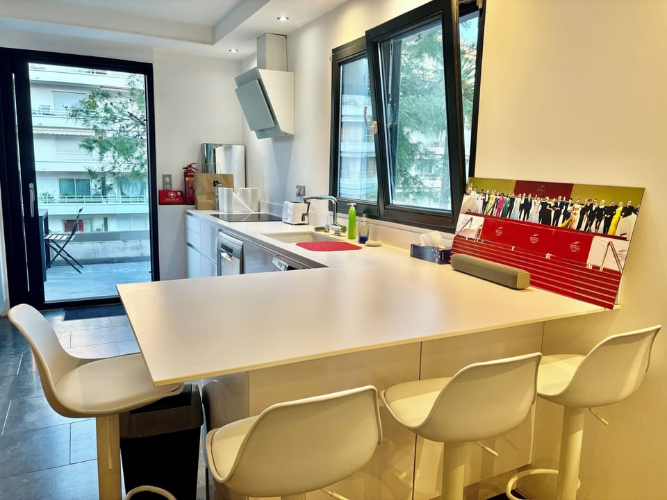 A bar is next to the kitchen with access to one of the terraces