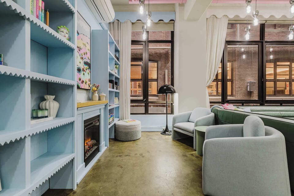LIVING SPACE: Open and spacious with 4m ceilings, expansive windows, and a cosy electric fireplace. This vibrant hideaway captures the essence of Melbourne charm. A colourful retreat made for slow mornings and soft landings after lilively nights out.