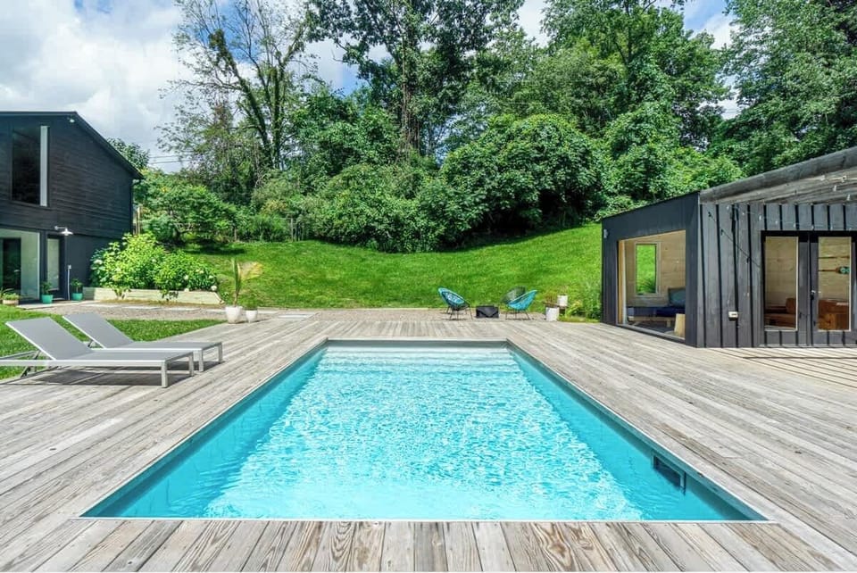 Backyard pool views (house to the left, pool house to the right) NOTE the pool house pictured is no longer there as come May this will be the location of the new Wellness Center (sauna, gym, cold plunge)