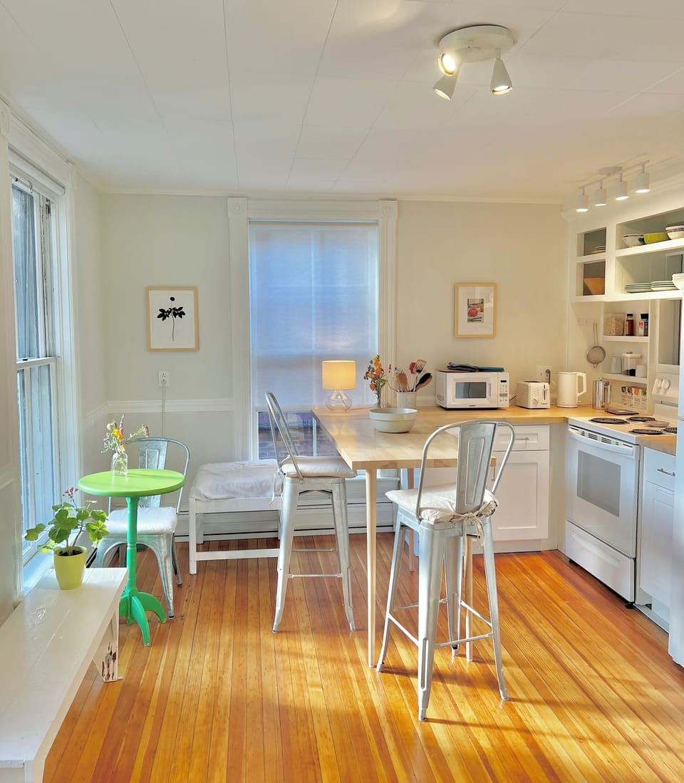 Kitchen with afternoon sunlight streaming in. 