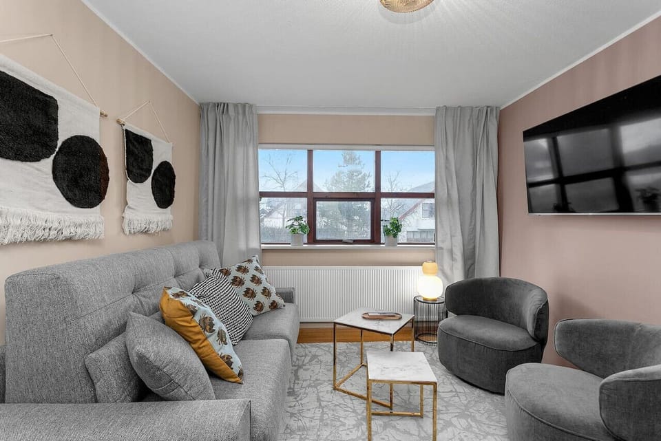The living area is designed for comfort and relaxation, featuring a flat-screen TV, making it the perfect spot to unwind, enjoy your favorite shows, or spend quality time with family and friend