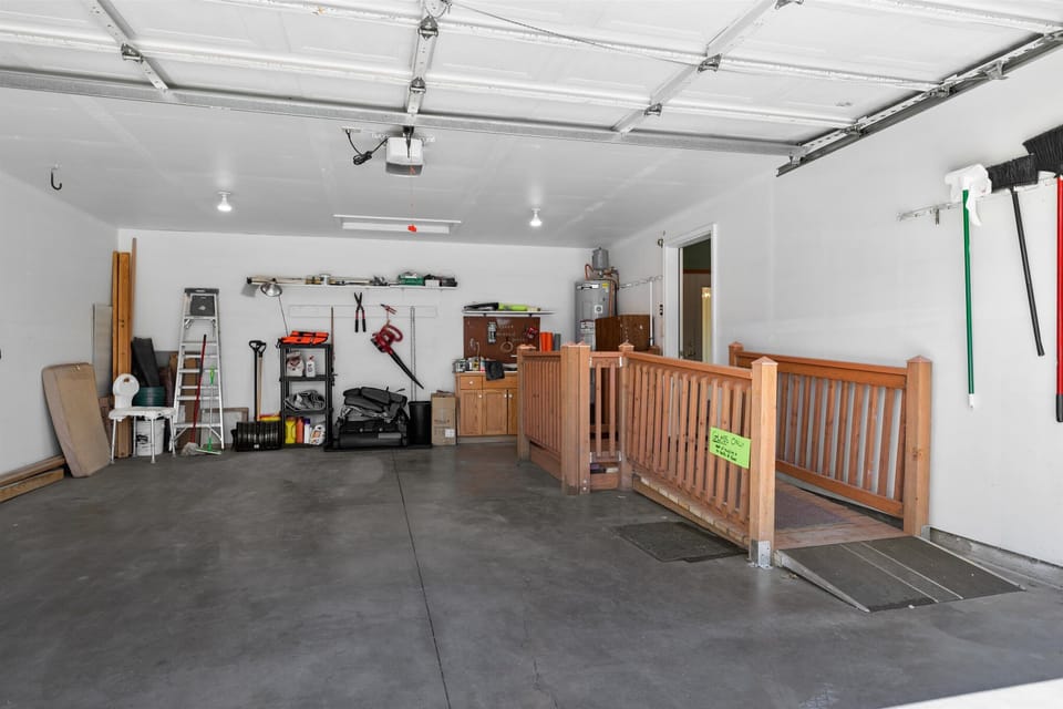 Additional parking space is available in the accessible garage. Wheelchair Ramp in Garage connects to inside the house.