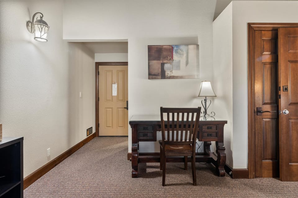 The king suite includes a private ensuite, balcony, desk, & Smart TV
