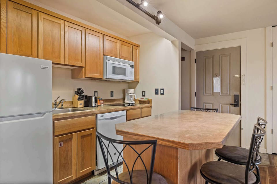 Sip morning coffee or grab a bite at the kitchen counter, with seating for 4