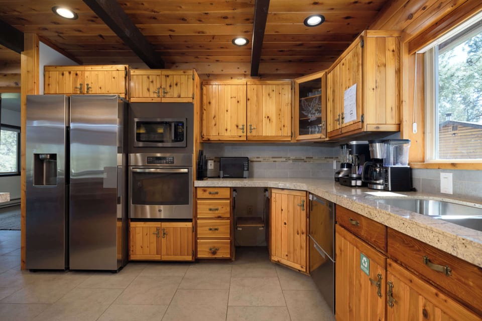 The inviting kitchen offers ample space & all the comforts of home