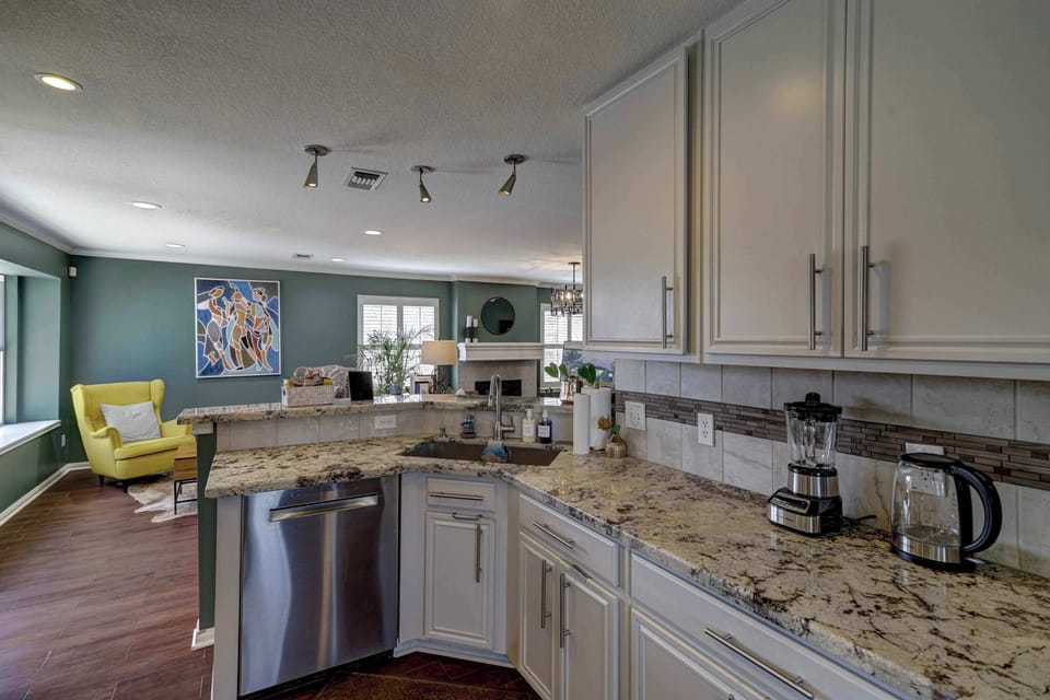 The open, airy kitchen offers ample space & all the comforts of home