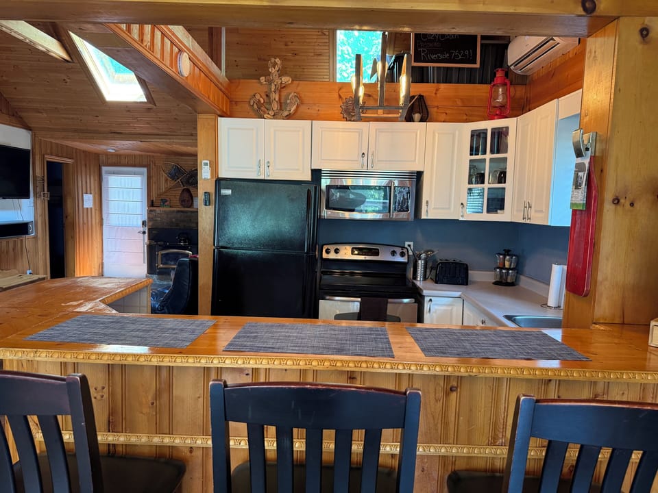 Open concept kitchen to livingroom. Allowing to cook and still be involved!