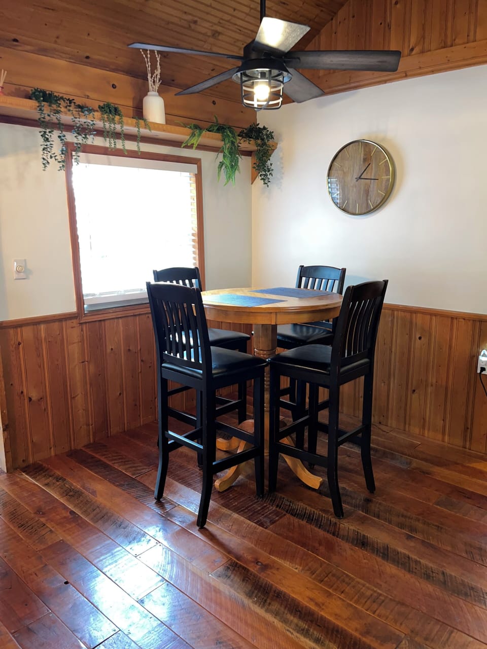 Dining area with dining table and seating for 4 guests.
