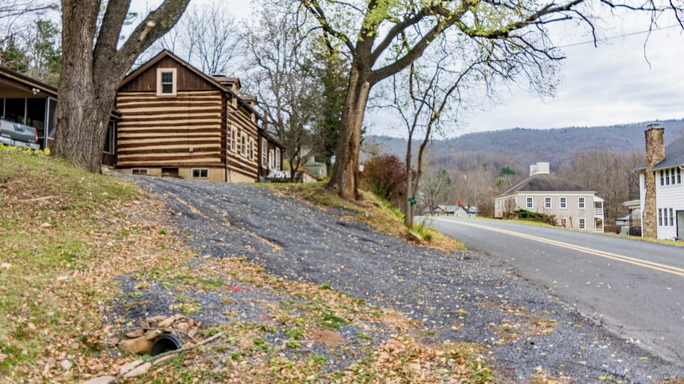 Steep gravel driveway can fit 2 vehicles