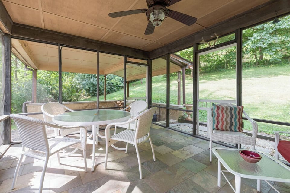 Screened porch off the kitchen for dining and morning coffee