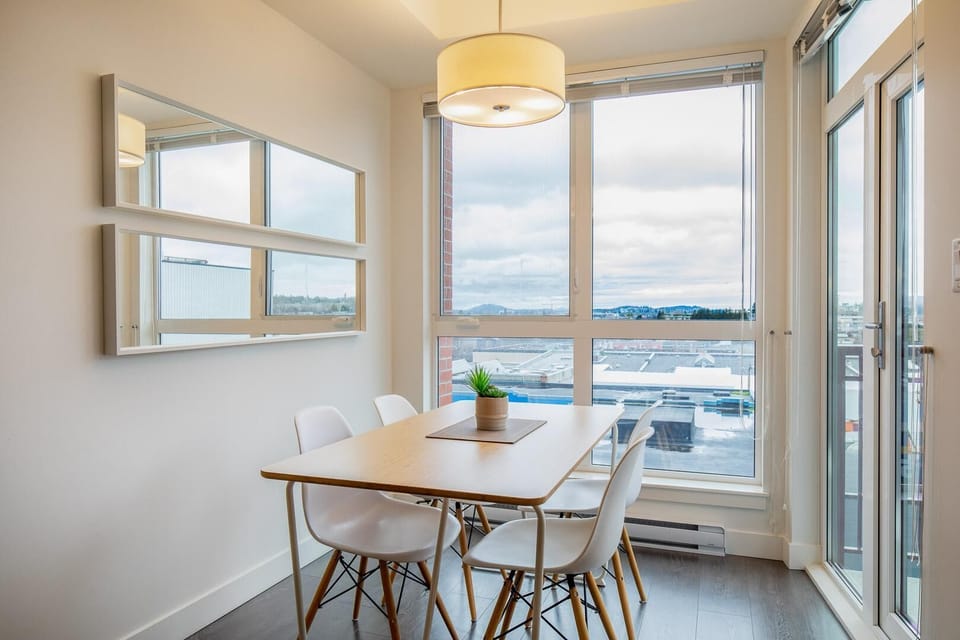 Dinner for two! Enjoy memorable vacation meals or your morning coffee at this intimate wood dining table set positioned perfectly next to the patio doors.