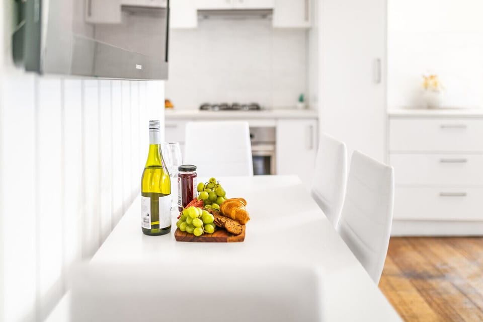 Bright dining area with a modern table—ideal for shared meals and good company 🍽️✨