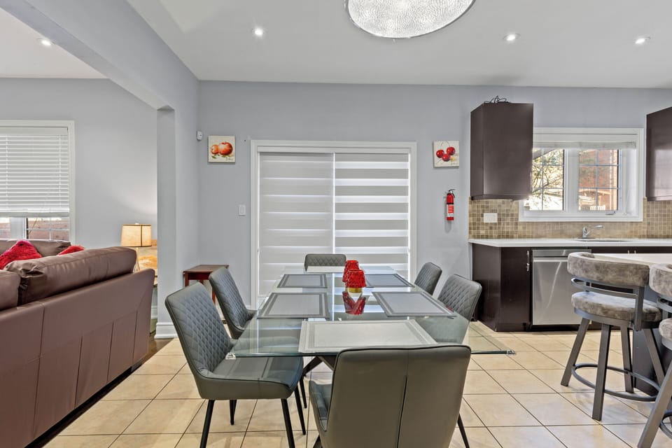 Dining area 2: Bright open-concept space with 6-seat glass dining table 