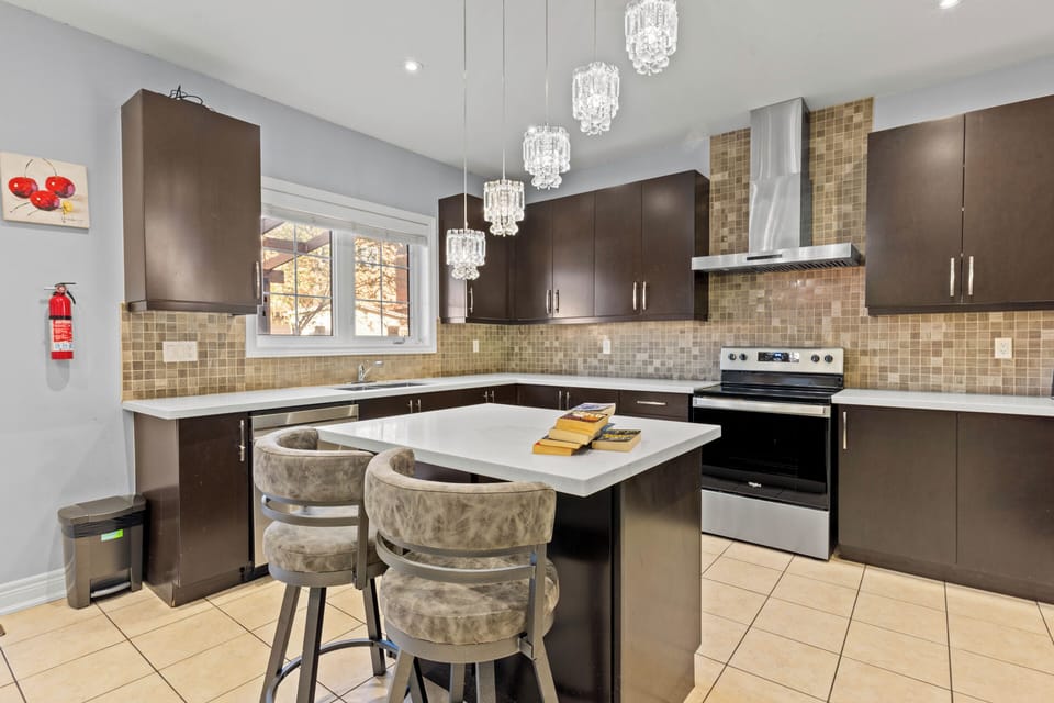 Kitchen window with open view to private backyard, 2 bar chairs for convenience!