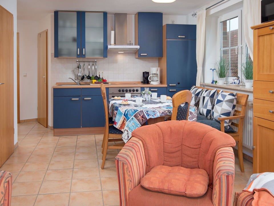 Furniture, Wood, Interior Design, Flooring, Kitchen, Floor, Countertop, Cabinetry, Room, Chair
