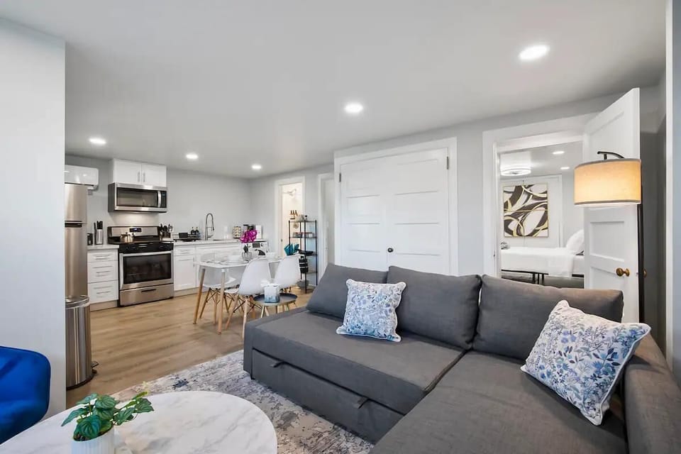 The heart of the home – gather around the dining table or lounge on the inviting sectional, all within this bright and airy space