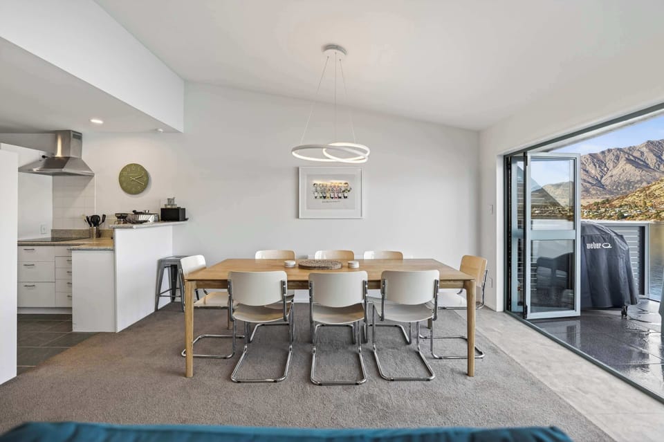 Dining room showing kitchen and balcony